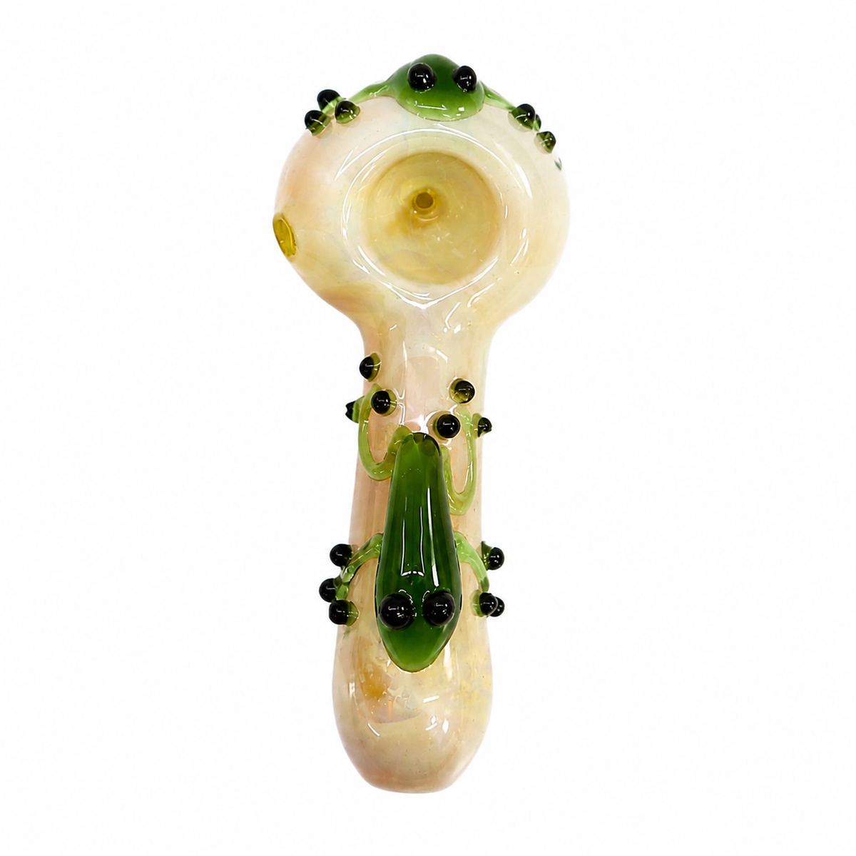 A hand-blown glass smoking pipe with a mushroom-shaped bowl and stem, decorated with green glass vines, black seed beads, and a green frog figure at the base, shown on a plain white background.

