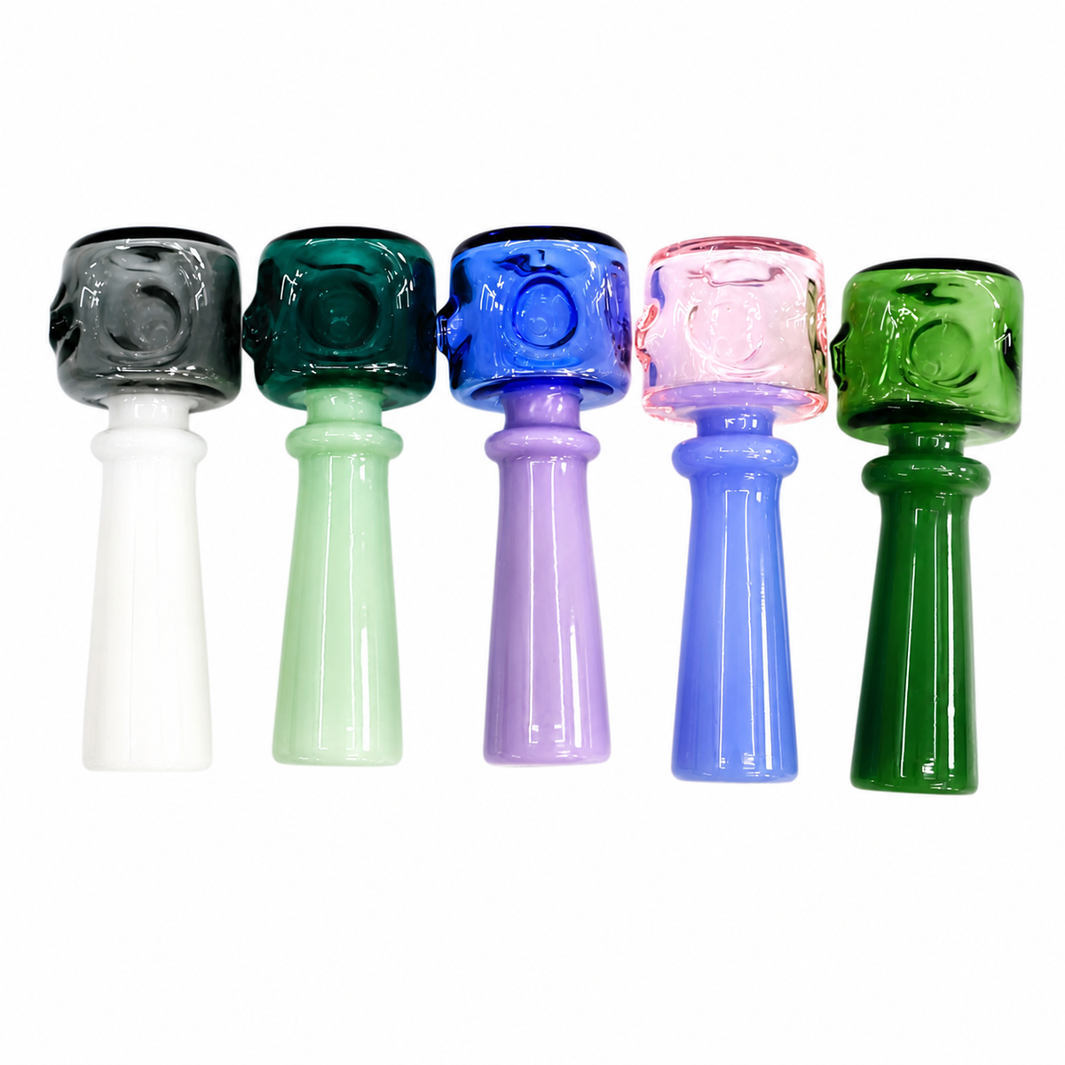 Five glass water pipes in different colors (black, green, blue, pink, and dark green) arranged in a row against a plain white background.

