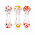 Three Spoon glass with speckled designs on a white background