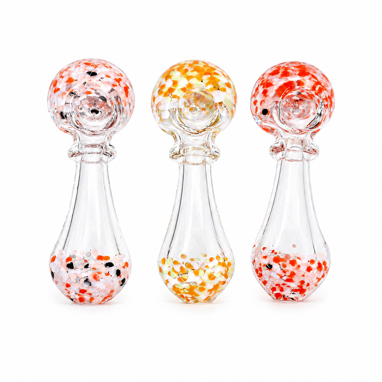 Three Spoon glass with speckled designs on a white background