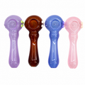 Four glass water pipes in purple, brown, blue, and pink, arranged in a row on a plain white background.

