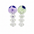 Two clear glass water pipes with spherical tops, one featuring purple and dark blue marbling, and the other featuring light green and dark blue marbling, set against a plain white background.

