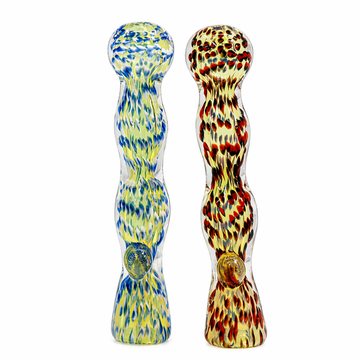 Two hand-blown glass water pipes standing upright on a white background. The left pipe is transparent with blue and yellow marbled patterns, and the right pipe is transparent with red, orange, and yellow marbled patterns.